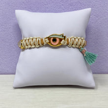 Load image into Gallery viewer, Iris evil eye leather bracelet on pillow wall

