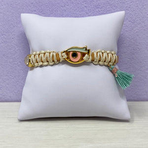 Iris evil eye leather bracelet on pillow wall