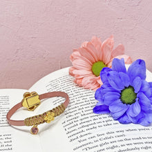 Load image into Gallery viewer, Marguerite leather bracelet on book
